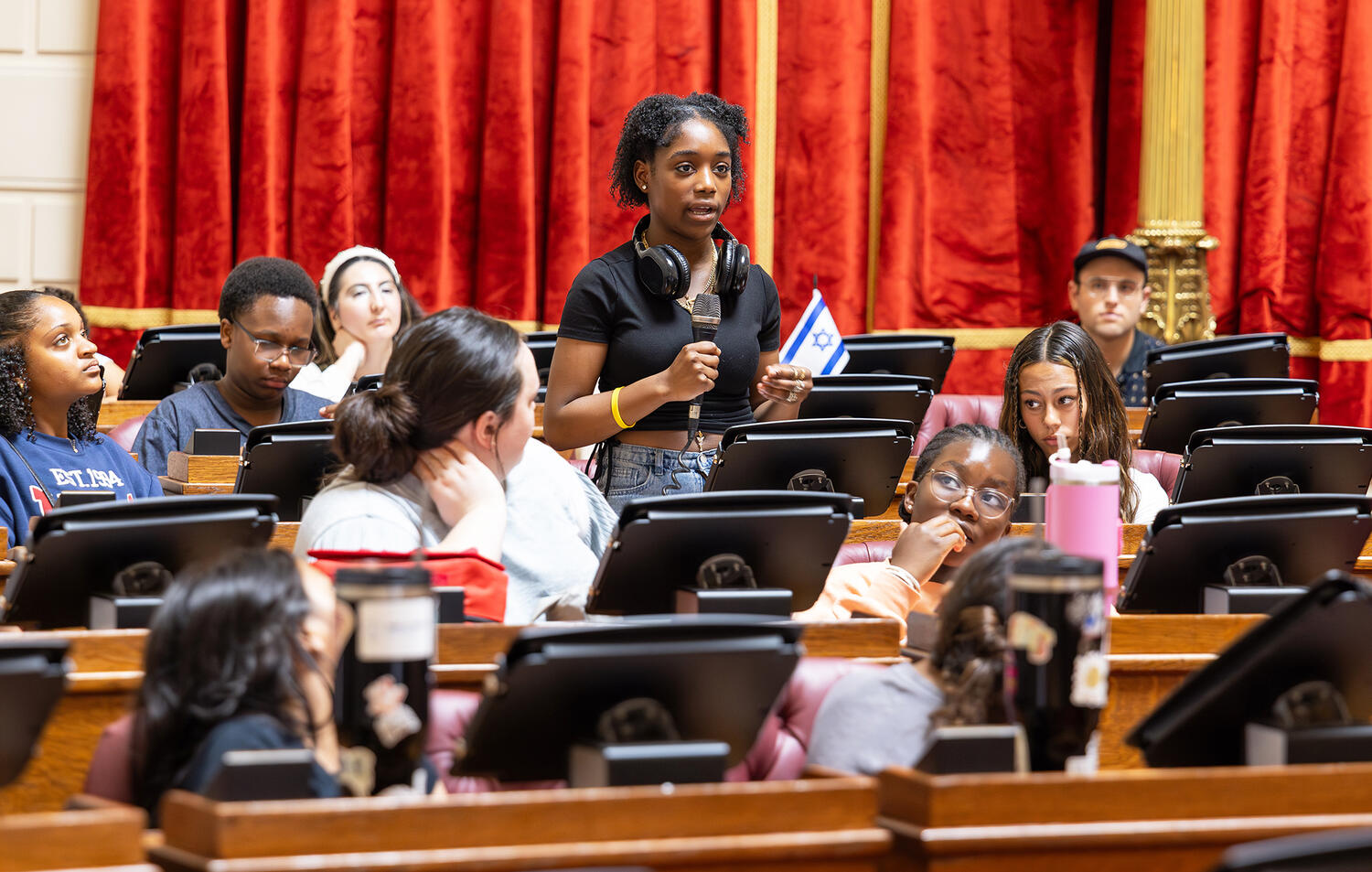 Mily, a rising eighth grader at Excel Academy, stands up during an engaging discussion on the House floor.