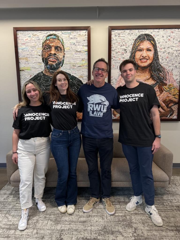 Group picture of 2 females and 2 males with 3 wearing Innocence Project name on the front of their shirts and  wearing RWU  Law logo printed on the front of the shirt 