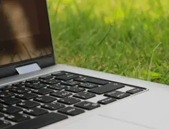 Laptop computer on grass