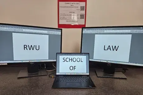 Computer monitors hooked up to a laptop - docking station