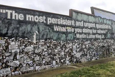 Mural with the words "The most persistent and urgent question is, what are you doing for others?" Martin Luther King Jr.