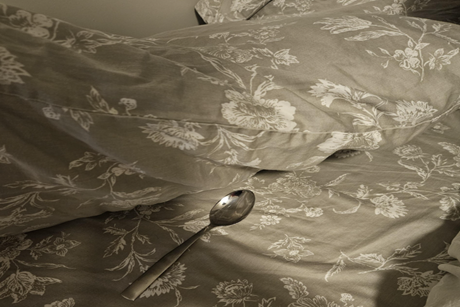 Spoon on white tablecloth