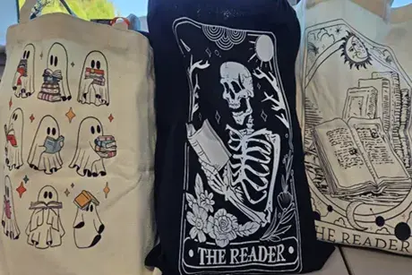Sample prizes, 3 reusable canvas bags with various Halloween decorations.