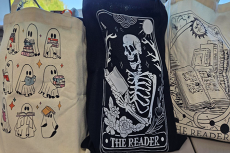 Sample prizes, 3 reusable canvas bags with various Halloween decorations.