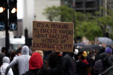 Racism protest sign