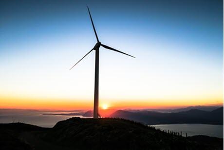 Wind turbine in front of a sunrise