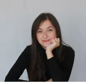 Law graduate smiling into the camera