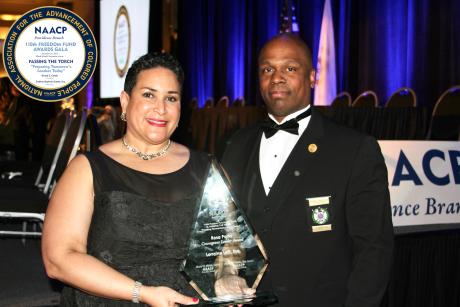 Image of Lorraine Lalli L'01 accepting NAACP Providence Rosa Parks Award 2023