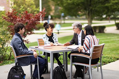 Law School Dean Gregory Bowman sits down with students.