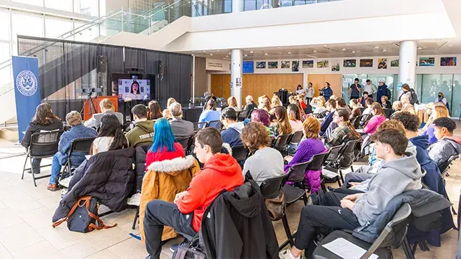 Crowd gathers in Global Heritage Hall to celebrate Fred Korematsu.