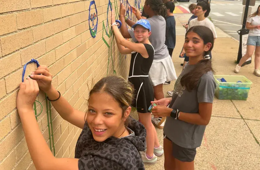 Campers take part in tape art.