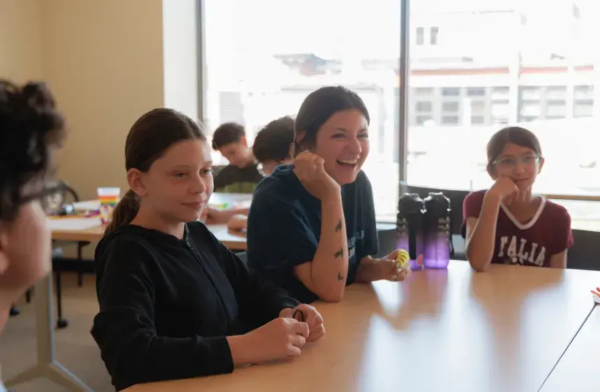 Campers laugh and engage in dialogue.