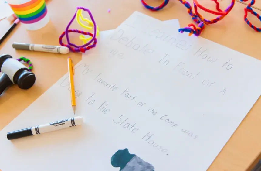A camper wrote what they learned during the week and notes their favorite part of camp was visiting the State House.
