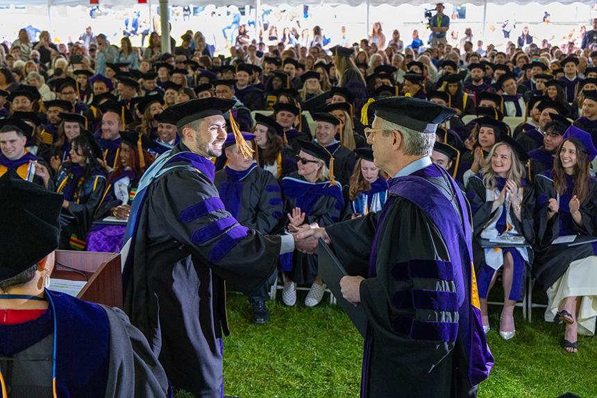 A graduate receives their degree